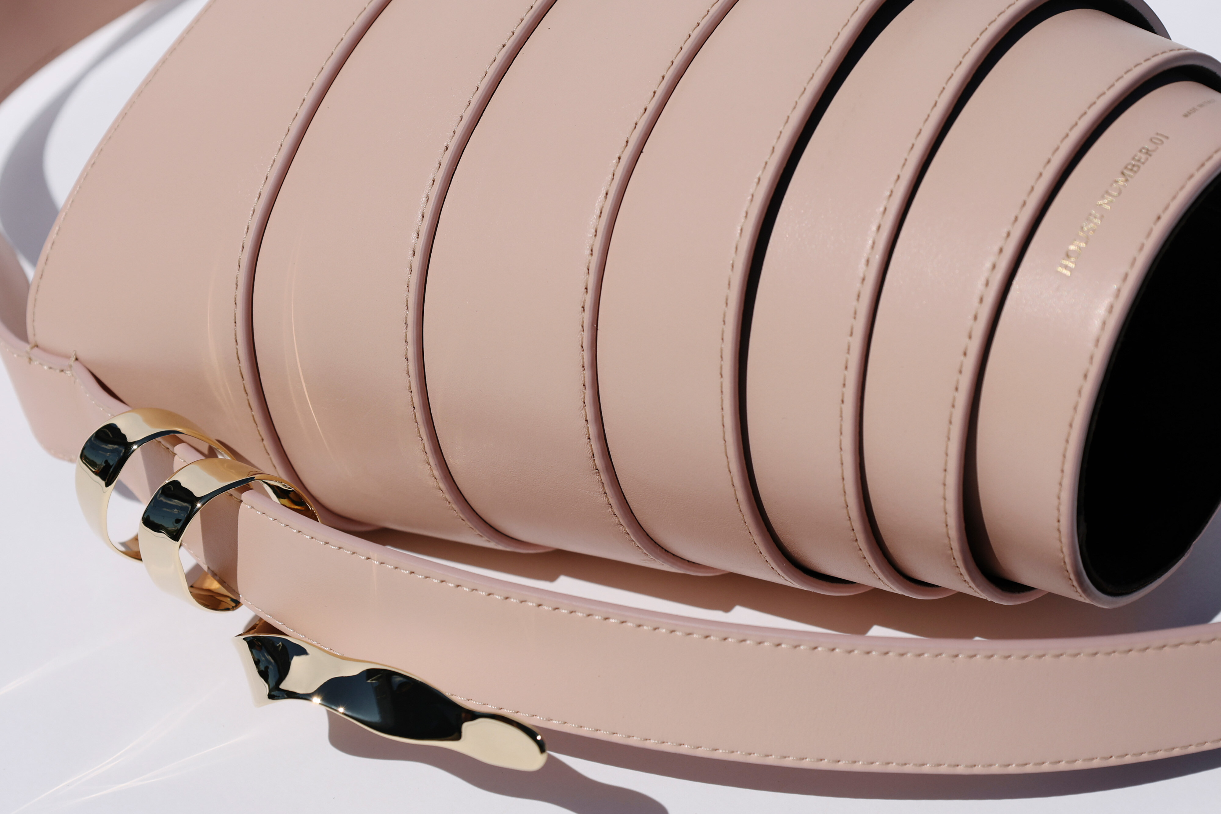 Cream leather with gold hardware and HOUSE NUMBER.01 stamp