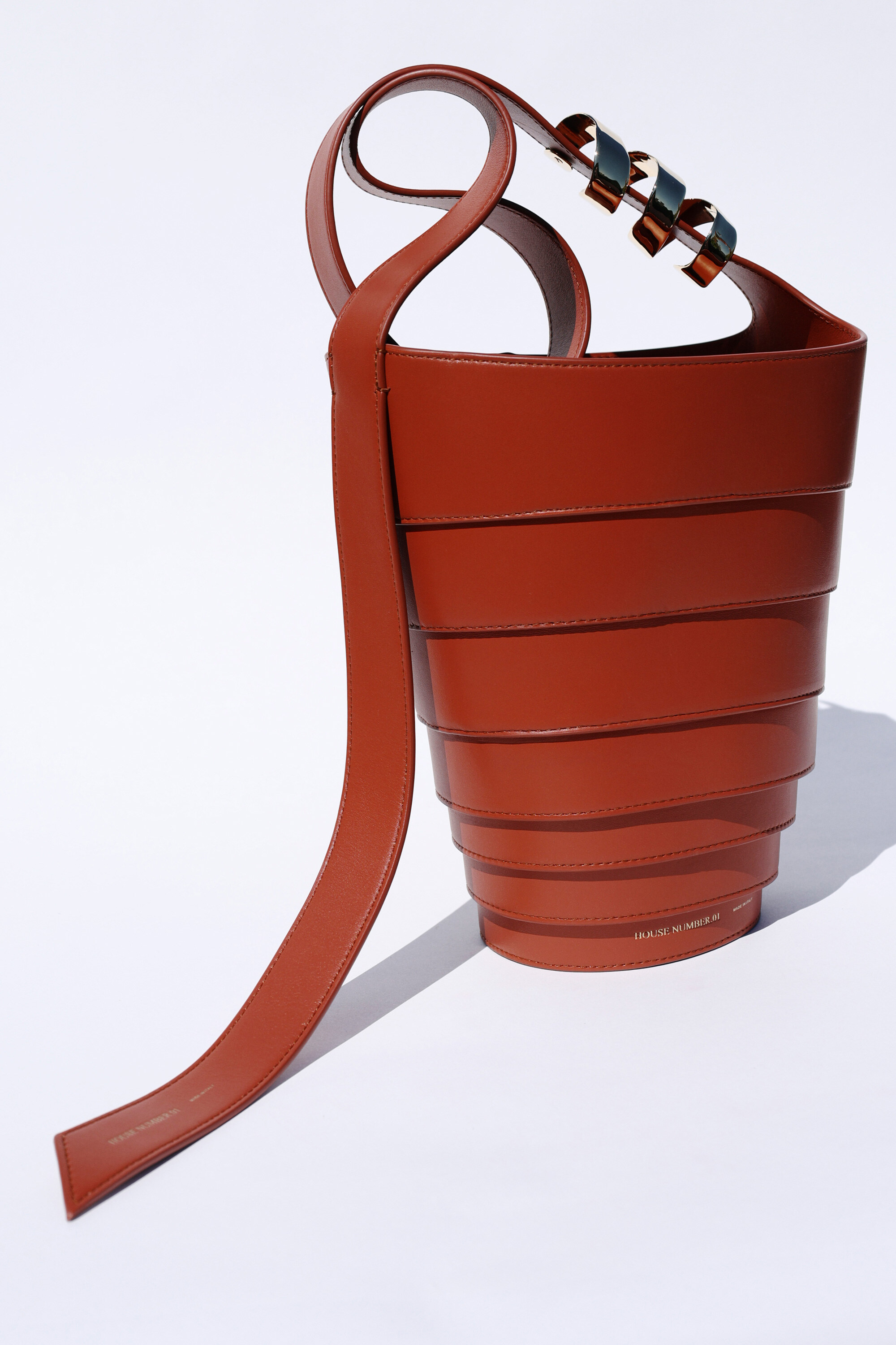 The Spiral Bag in cognac leather, three-quarter view