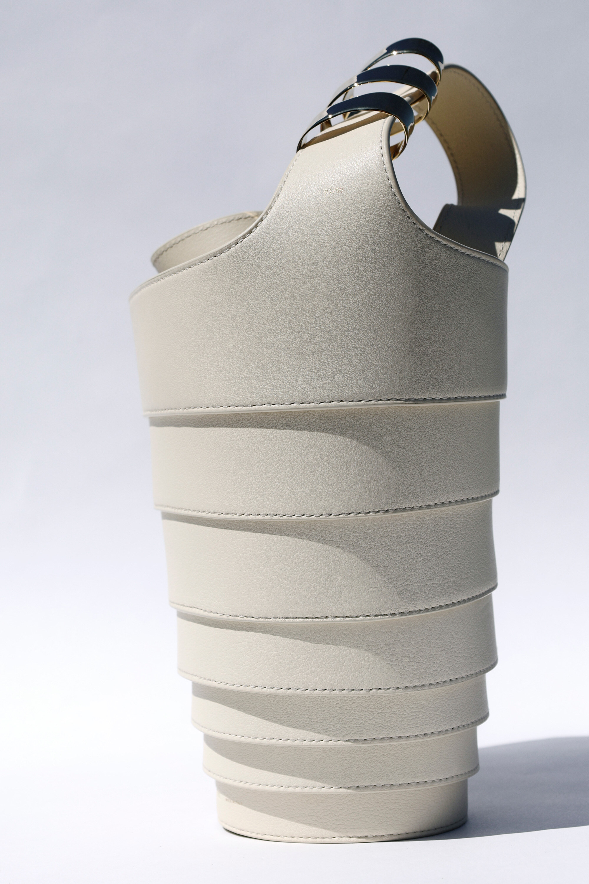 The Spiral Bag in cream, three-quarter view