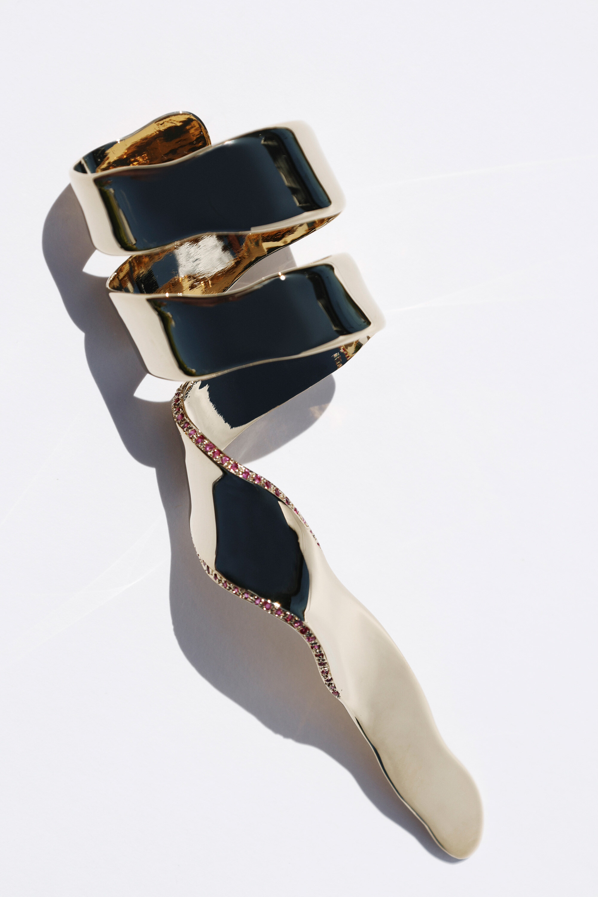 Gold spiral jewelry with black inlay