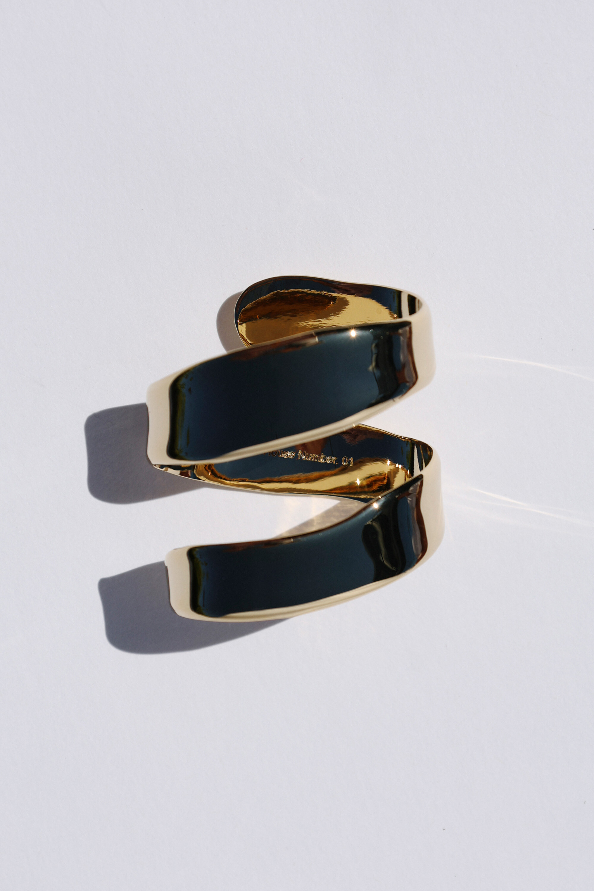 Gold spiral jewelry engraved Series Number. 01